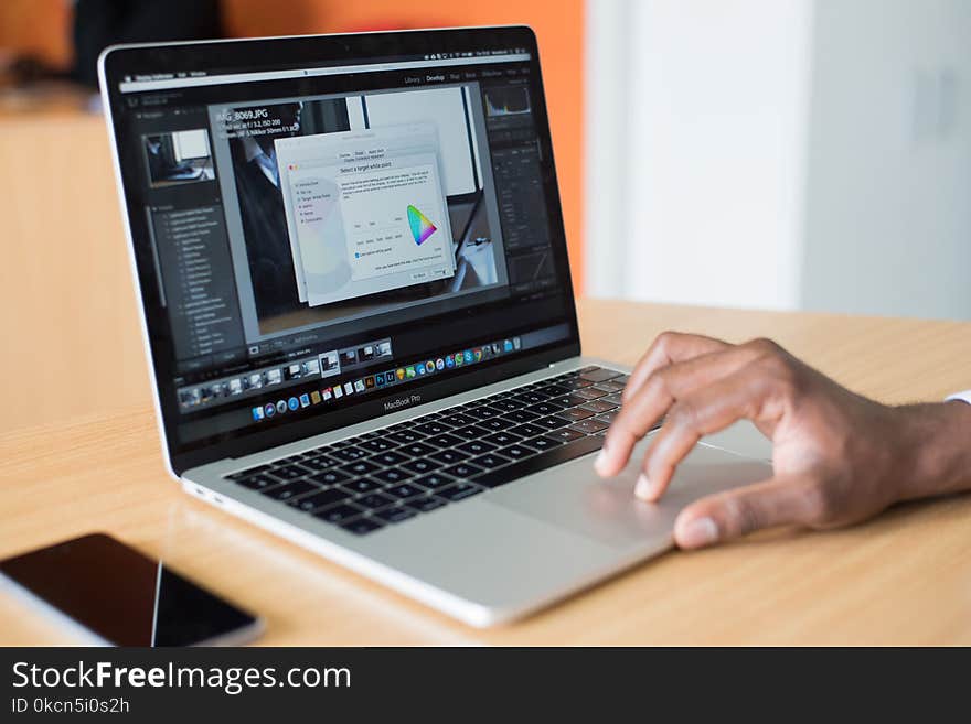 Person Operating Macbook Pro