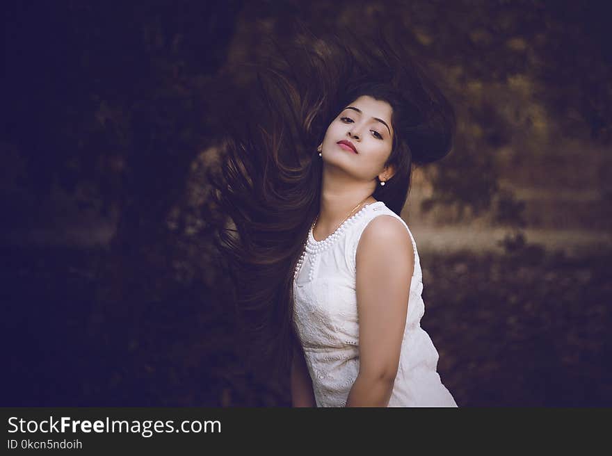 Selective Focus Photography of Woman in White Crew-neck Sleeveless Dress