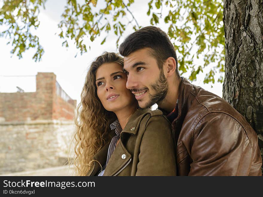 Man And Woman Near Tree