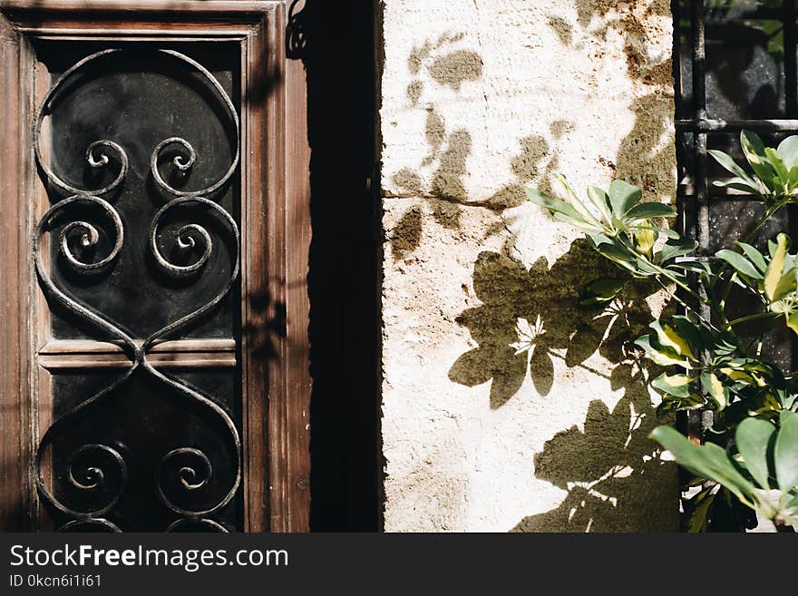 Brown And Black Wooden Window Pane