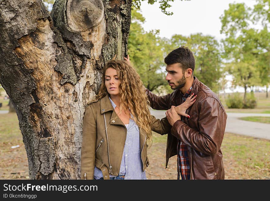 Man And Woman Wearing Brown Full-zip Jackets