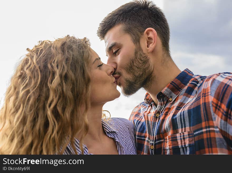 Woman And Man Kissing Each Other