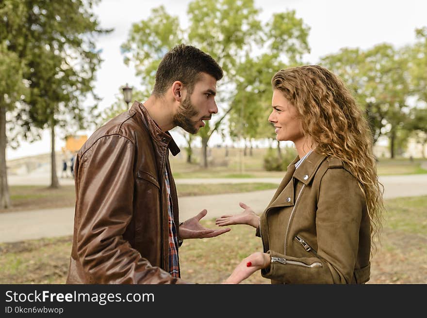 Man And Woman Wearing Brown Leather Jackets