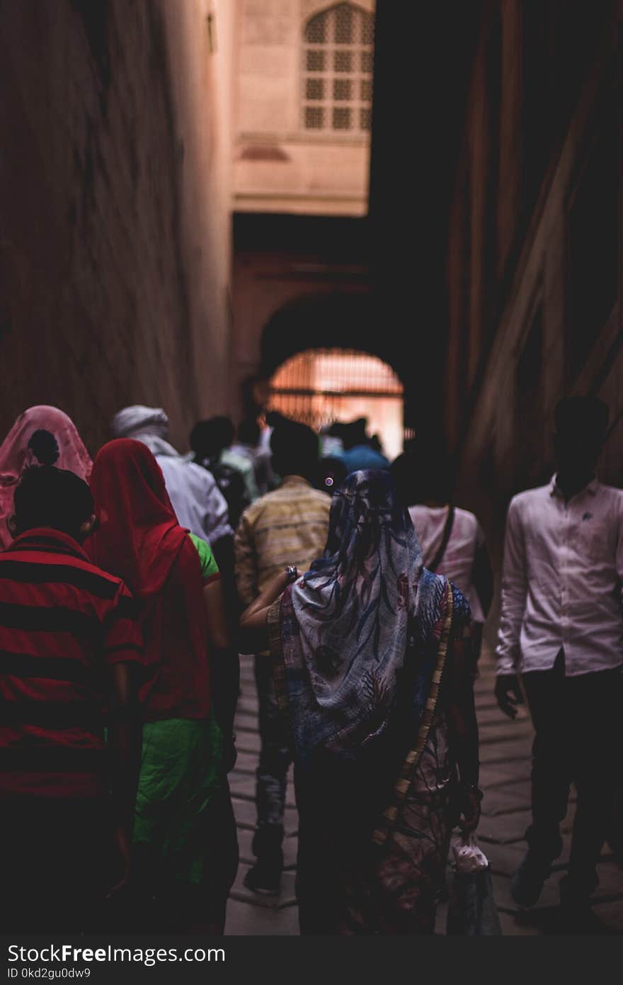 Photo of People Walking Towards Gate