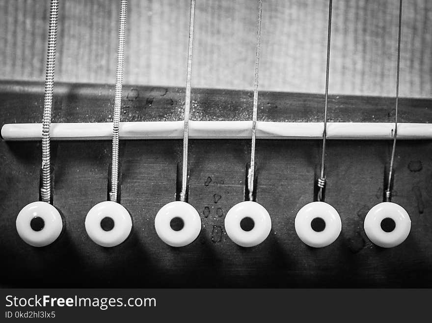 Closeup Grayscale Photo of Acoustic Guitar