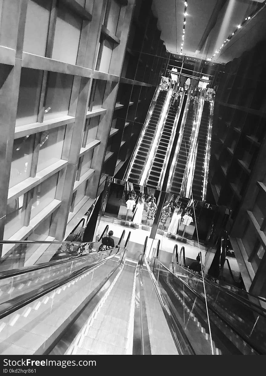 Grey Scale Photo of Escalator