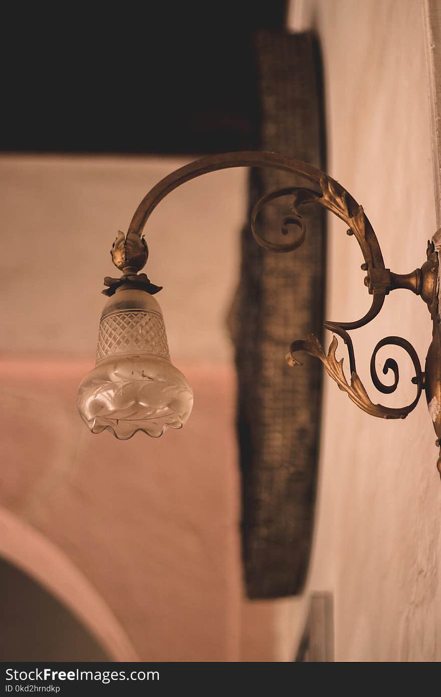 Selective Focus Photography of Brown Framed Sconce