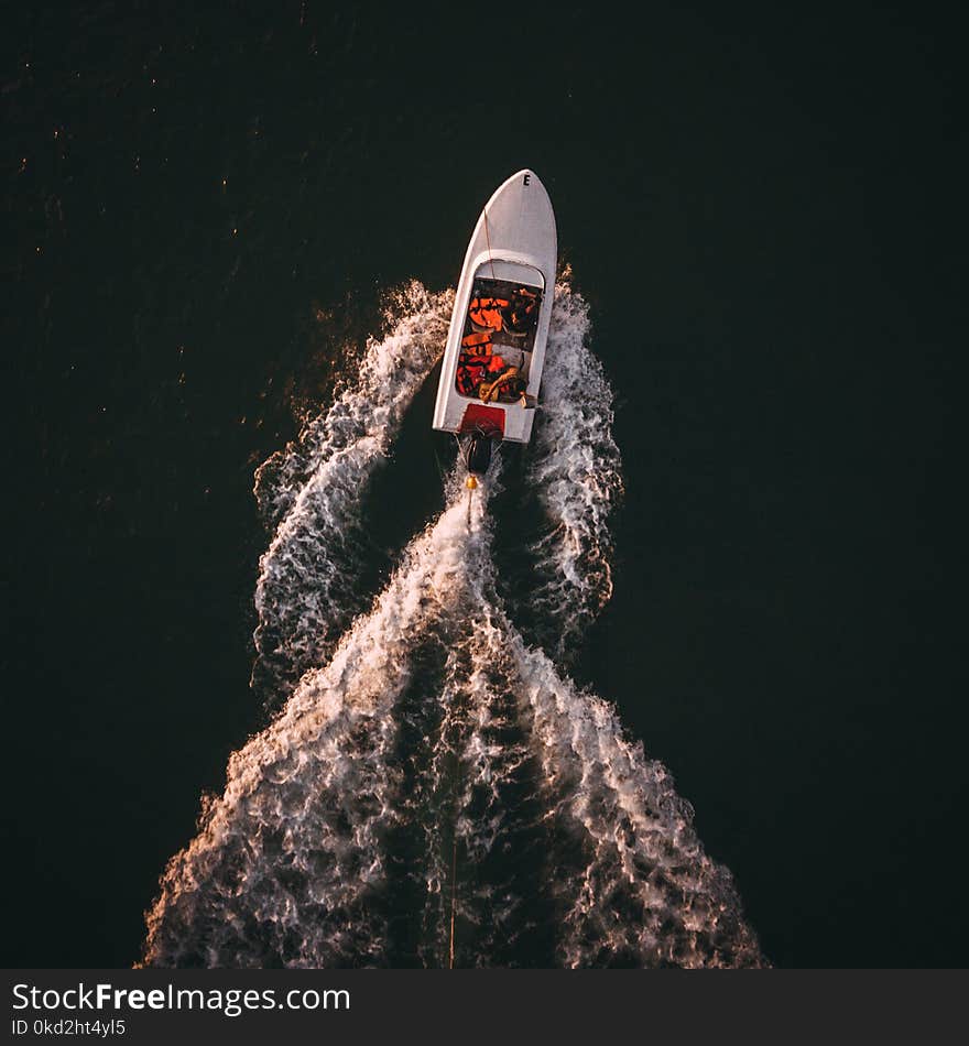 Aerial Photo of White Boat