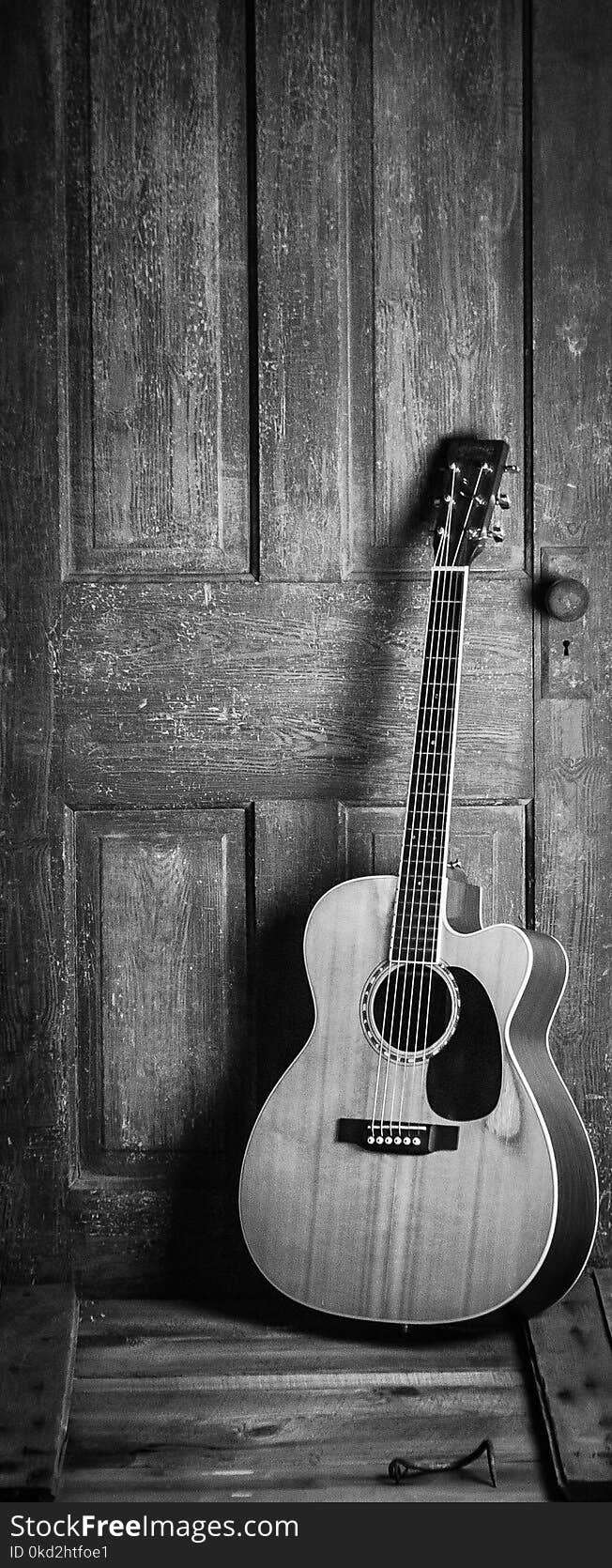 Brown and Black Cut-away Acoustic Guitar