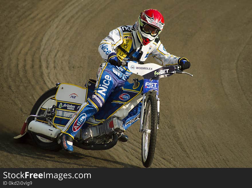 Man Rides Motorcycle on Race Track