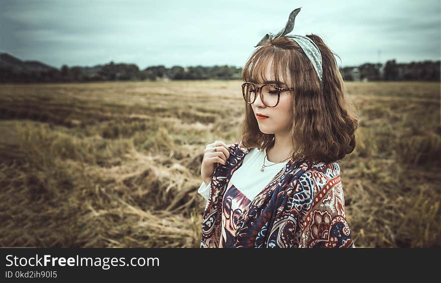 Selective Focus Photography of Woman Wearing Black Framed Eyeglasses and Gray Headband