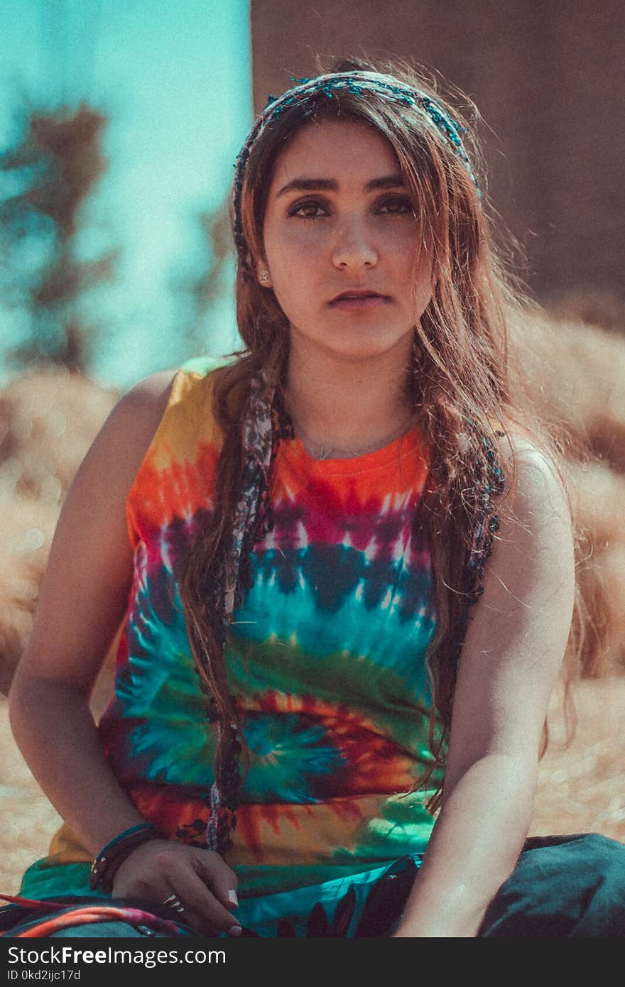 Woman in Red, Blue, and Orange Tie Dye Tank Top Macro Shot