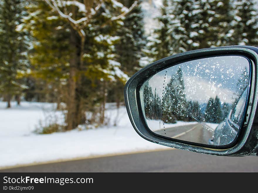 Framed Side Mirror Beside Snow Covered Field