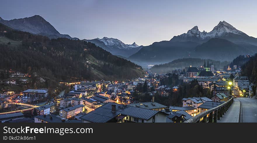 Birdseye Photography of City Buildings Near Trees and Mountains