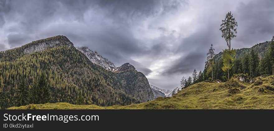 Landscape Photography of Mountains Under Gray Cloudy Sky