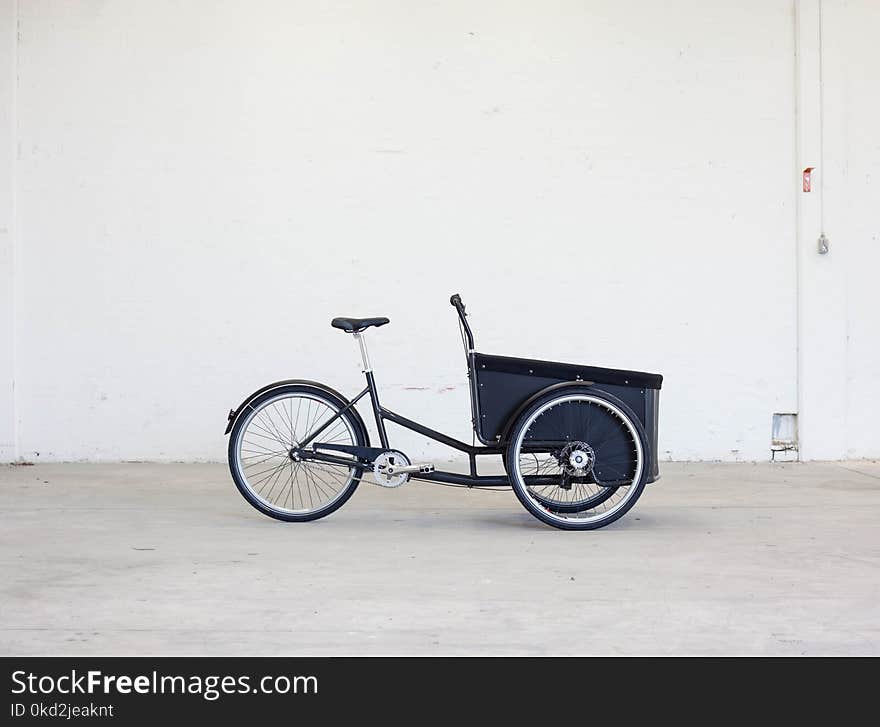 Shallow Photography of Black Steel Adult Trike