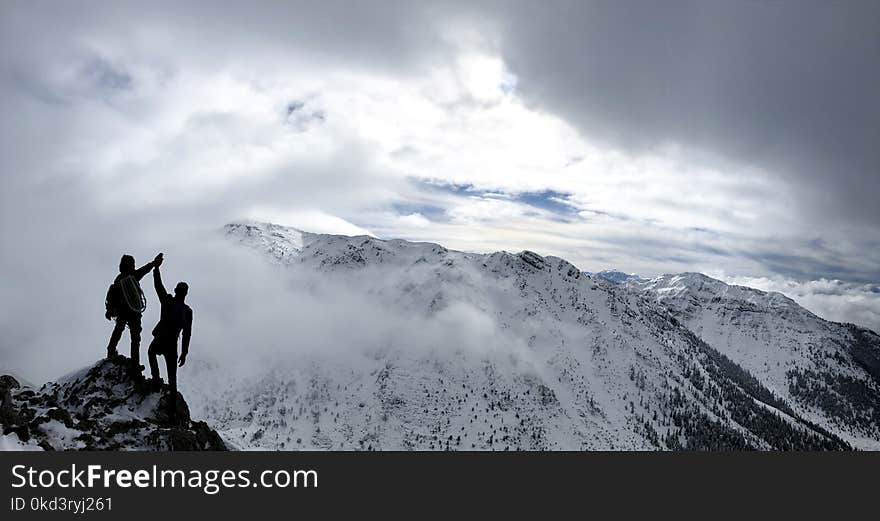 Mountaineers reaching the target in the summit mountains. Mountaineers reaching the target in the summit mountains