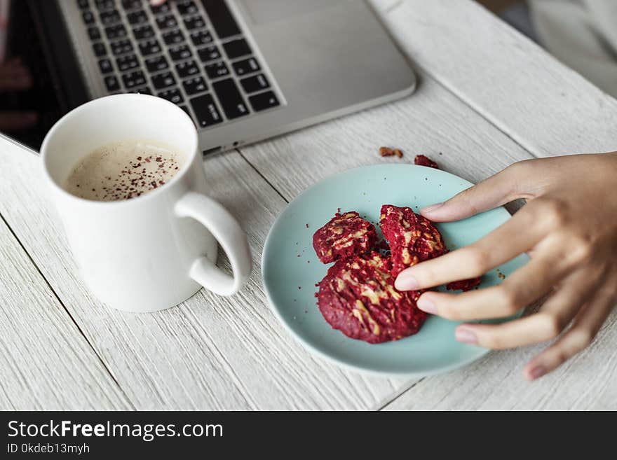 Cookies on Round Teal Ceramic Plate Beside White Ceramic Mug