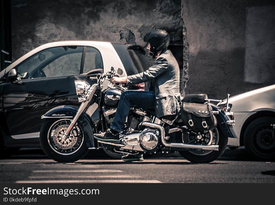 Man Riding a Black Touring Motorcycle