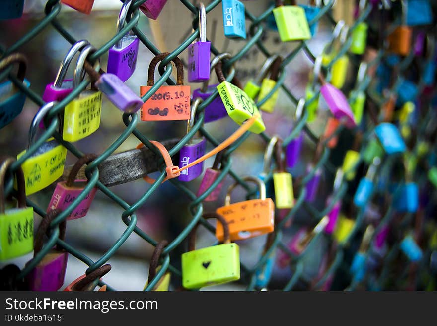 Green Chain-link Fence With Assorted-color Padlocks