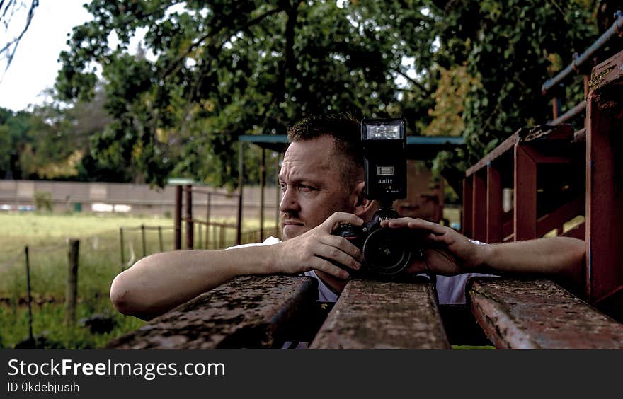 Man Holding Dslr Camera