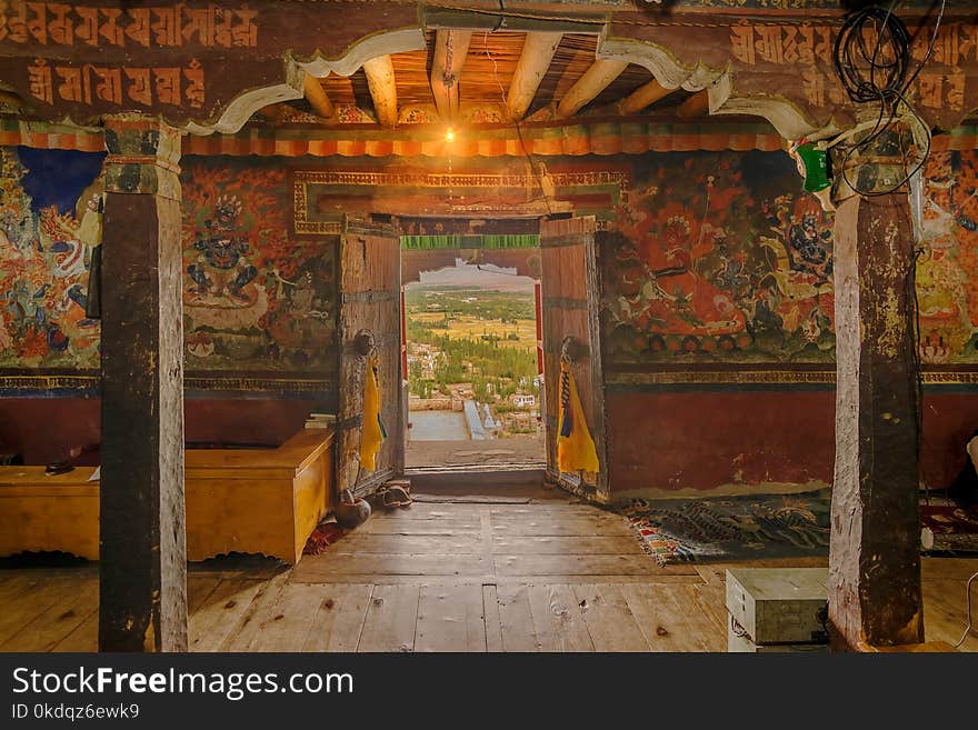 Ancient Thiksey monastery with view of murals on the inside wall and Himalayan mountians outside - it is a famous Buddhist temple in,Leh, Ladakh, Jammu and Kashmir, India. Ancient Thiksey monastery with view of murals on the inside wall and Himalayan mountians outside - it is a famous Buddhist temple in,Leh, Ladakh, Jammu and Kashmir, India.