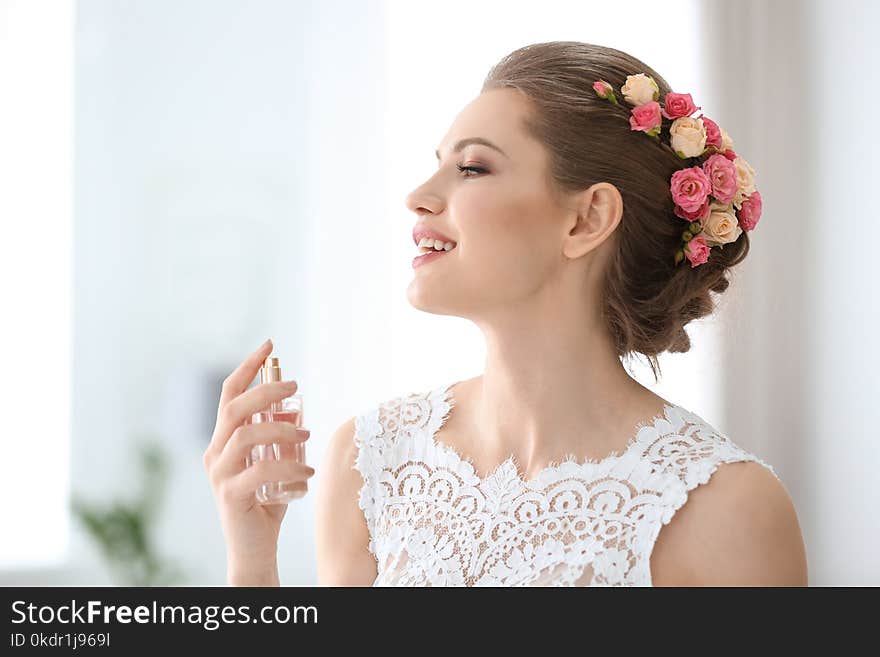 Beautiful Young Bride With Bottle Of Perfume