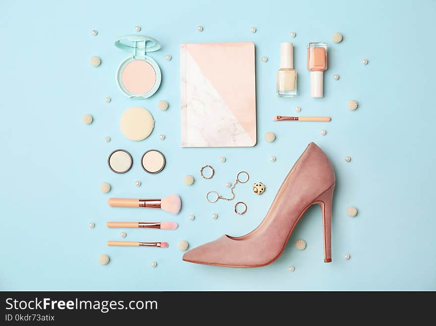 Flat lay composition with cosmetics and stylish accessories on color background