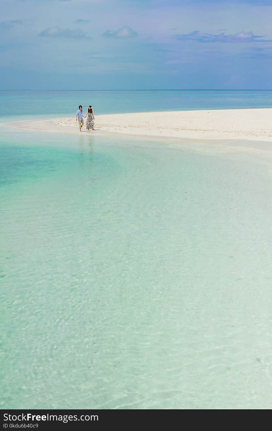 Two Person Walking on Beach