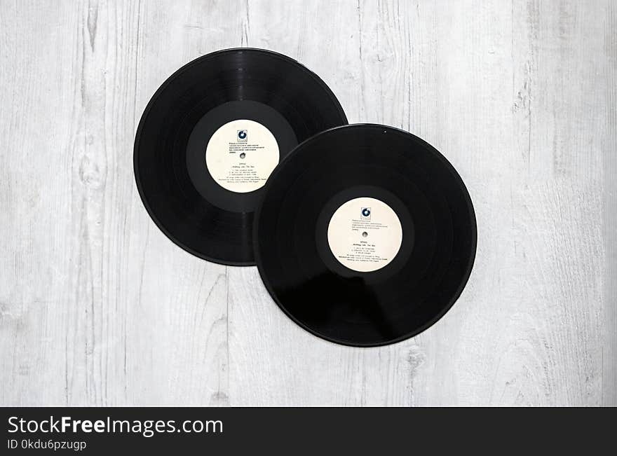 Photography of Vinyl Records On Wooden Surace