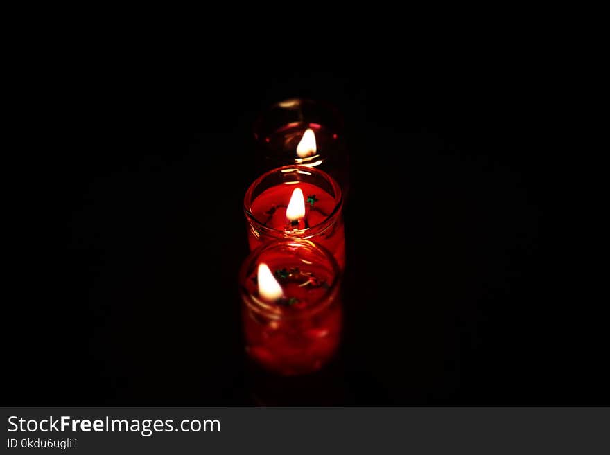 Photography Three Tealight Candles in Dark Place