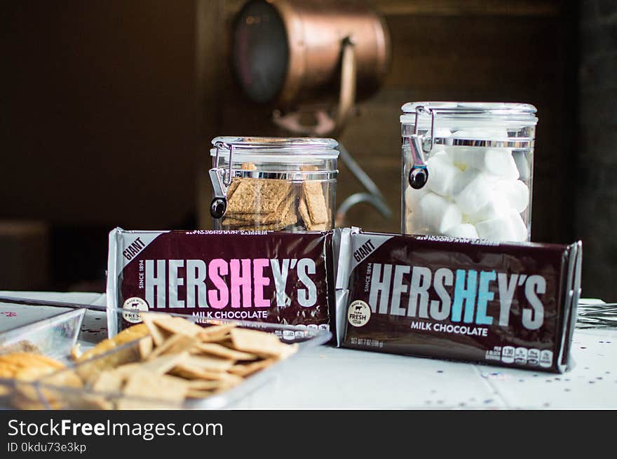 Close-up Photo of Hershey&#x27;s Bars Near Jars