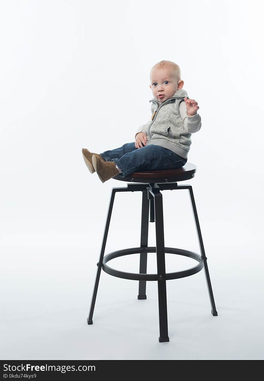 Child on Steel Framed Stool