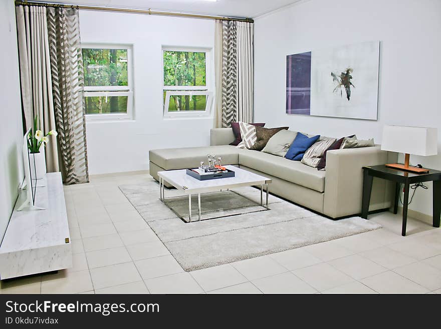 Gray Leather Sectional Sofa With White Coffee Table