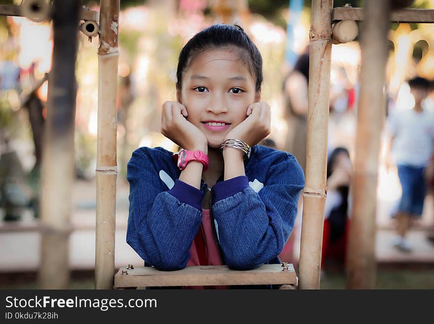 Girl Resting Her Hand and Wearing Pink Watch