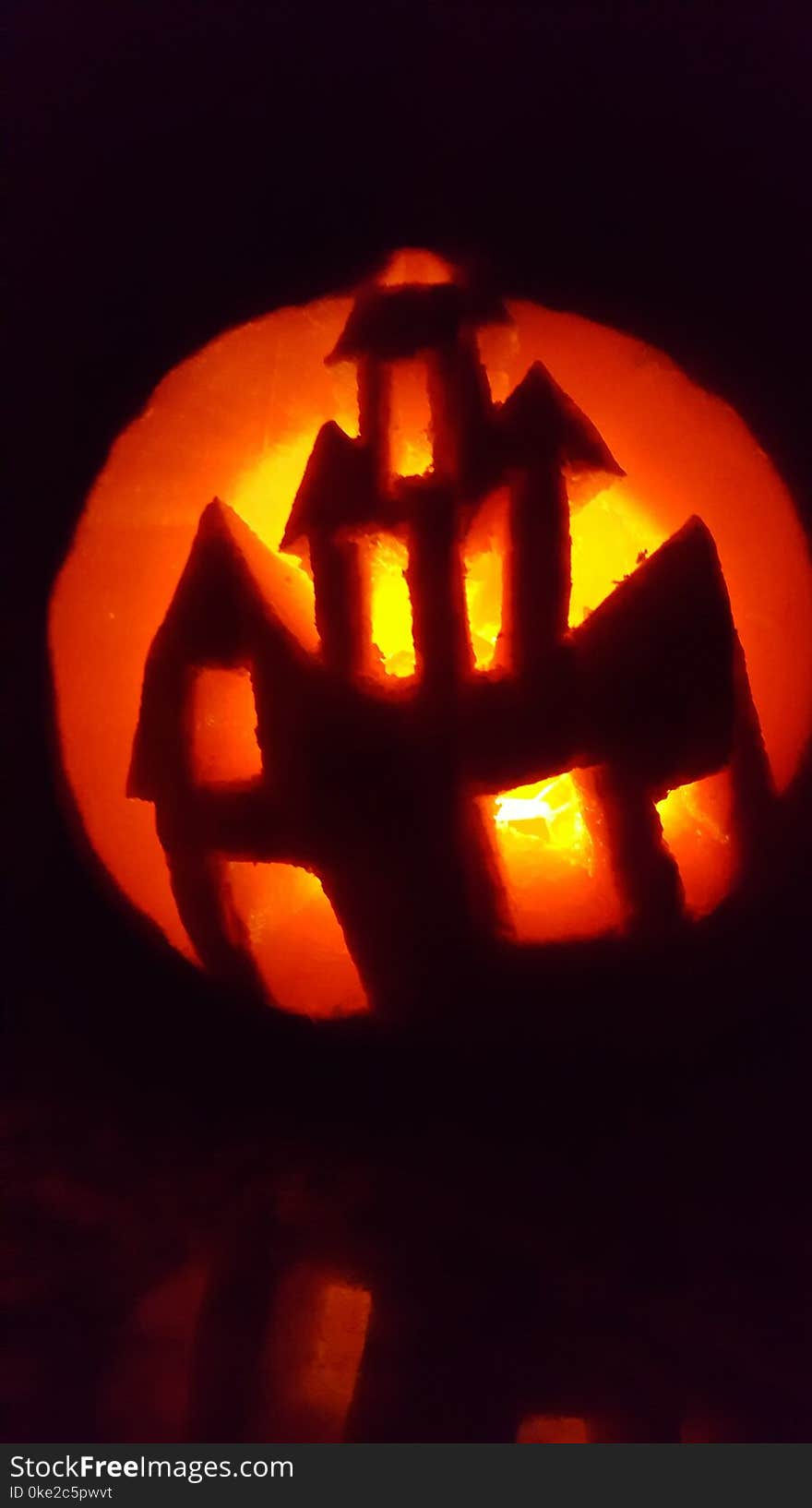 Halloween Pumpkin carvings with candle lights showing haunted house and dark