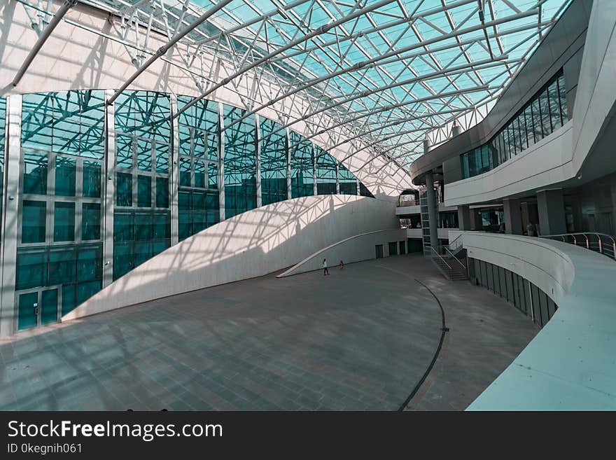 Person Walks Inside Glass Structure