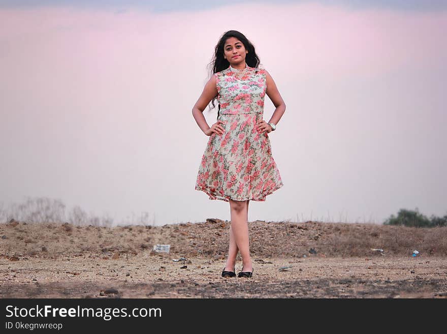 Photography of a Woman Wearing Pink And White Dress