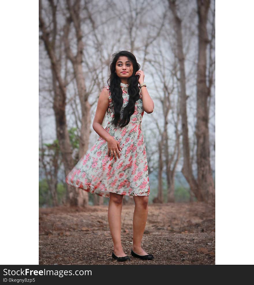 Photography of a Woman Wearing Pink And White Dress