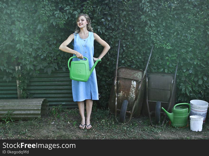 Photo of Woman Holding Watering Can