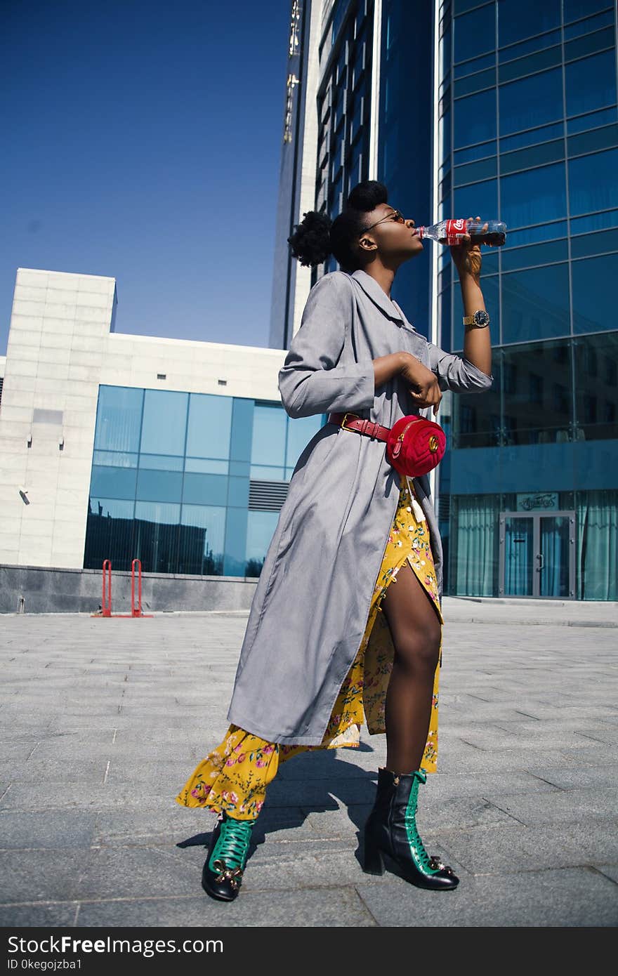 Woman Wearing Grey Long-sleeved Dress Drinking Soda