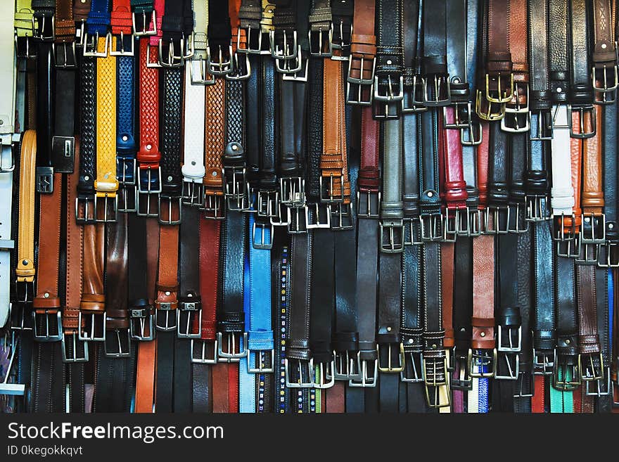 Shallow Focus Photography of Assorted-color Leather Belts