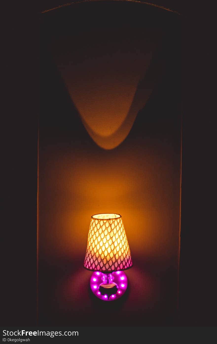 Photo of Yellow and Pink Table Lamp Turned on