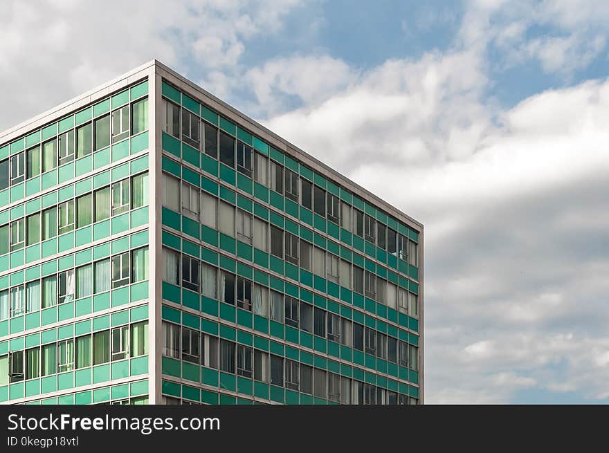 Photography of Building Under Cloudy Sky