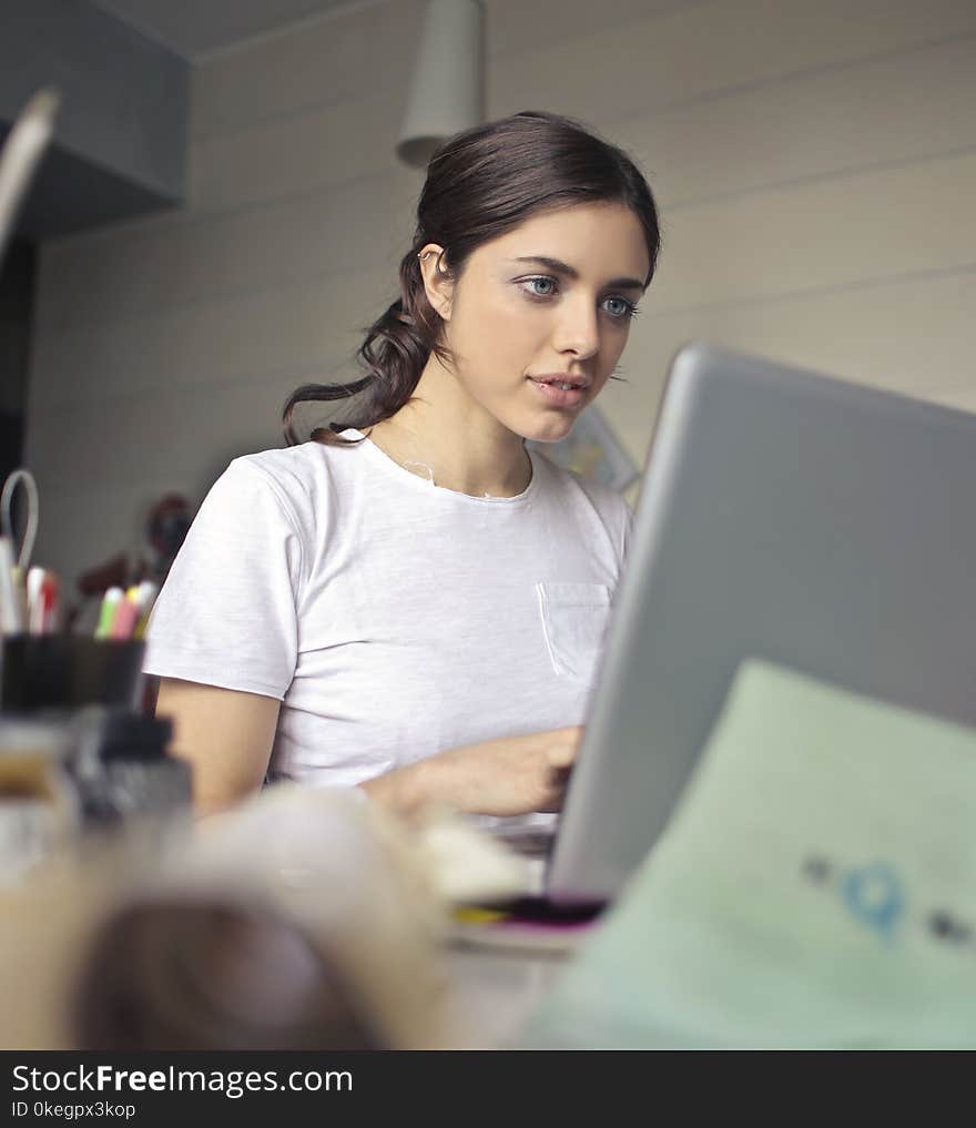 Photography of a Woman Using Laptop