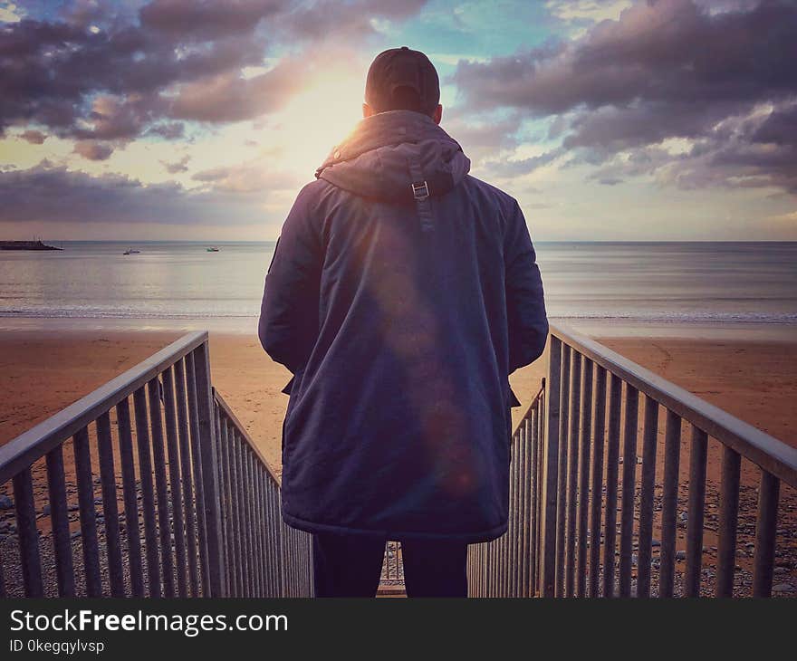 Man Standing on Stairs