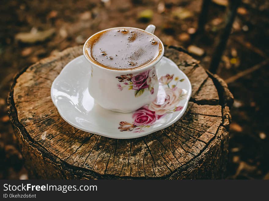 Close-UP Photography of Coffee on Tree Stump