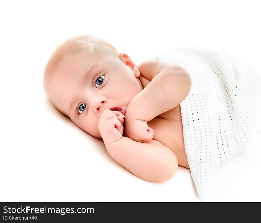 Portrait of a four months old baby on white background