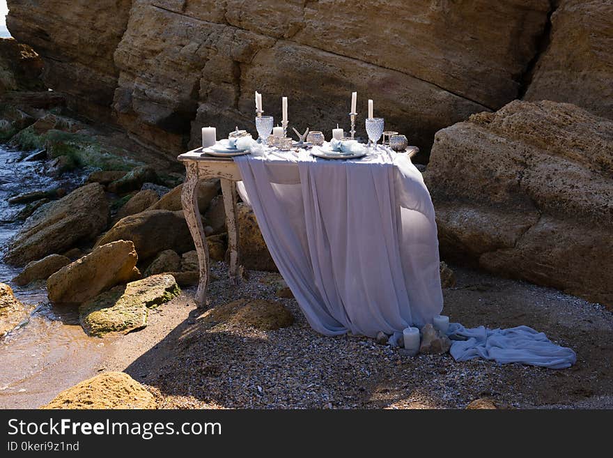 Wedding table decoration on a seashore. Sunny weather.