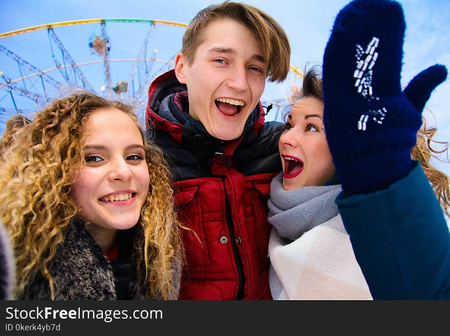 A Group Of Friends Do Selfie In The Winter In A Clearing